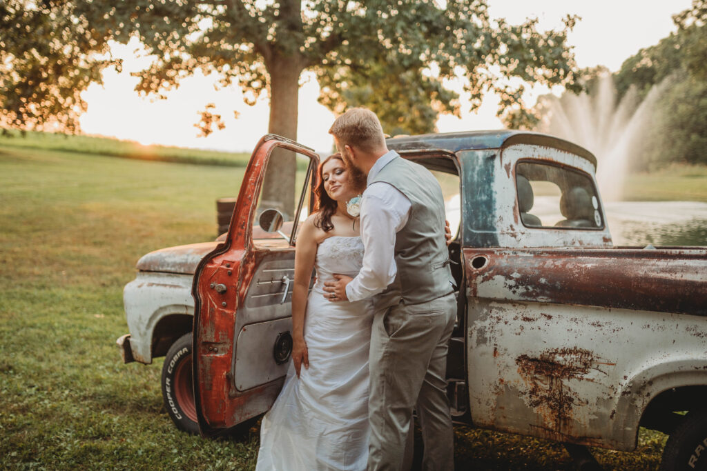 A couple embraces beside a vintage truck in Beckley, West Virginia.