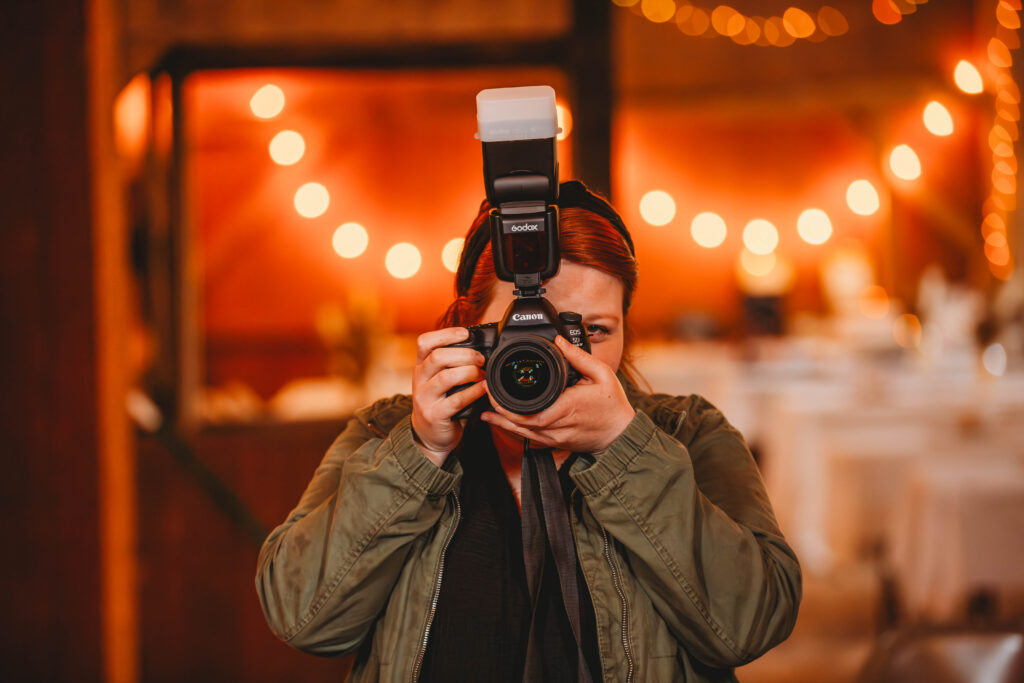 Melena Lawson with her camera at a wedding reception in Charleston, West Virginia. 