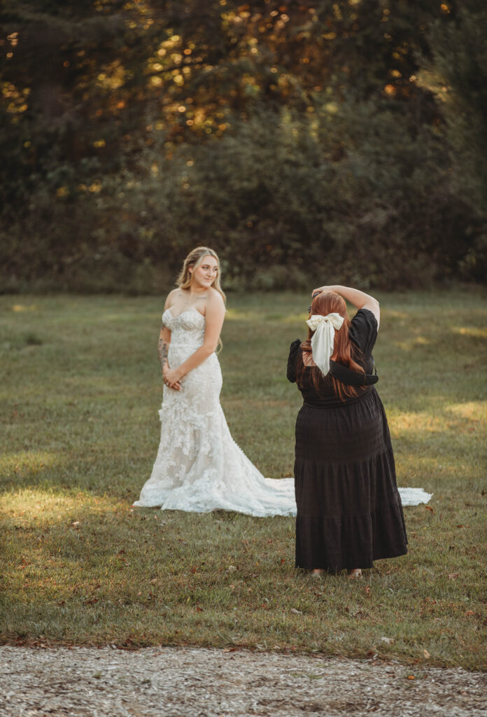 A photographer captures a beautiful bride at the Barn on Unity Farm in Princeton, West Virginia. 