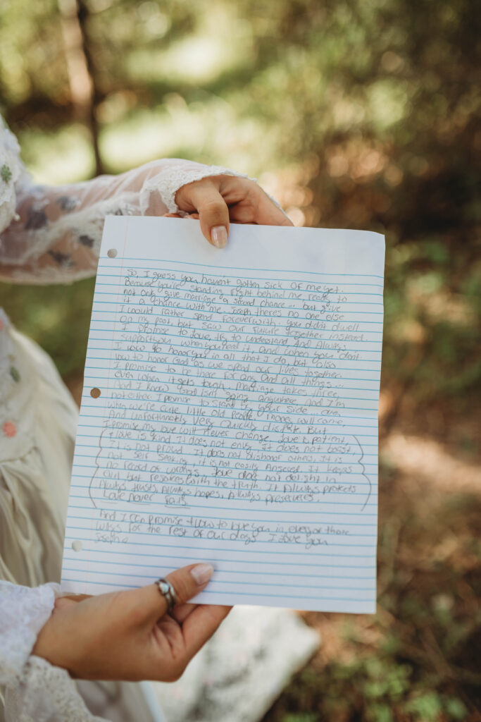 A bride shows the camera a handwritten letter to her groom in Roanoke, Virginia. 