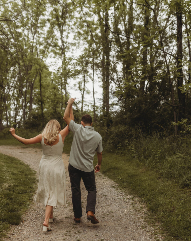 A couple dance and play together on a trail at Heritage Community Park in Blacksburg, Virginia.