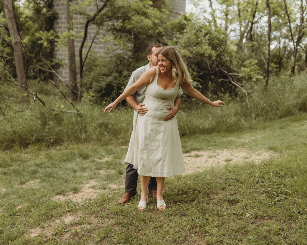 A couple dance and play together during engagement photos in Blacksburg, Virginia.