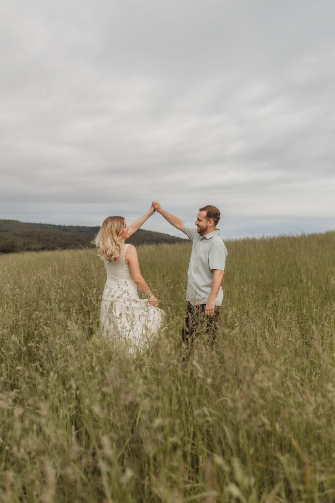 A couple dance together during their engagement photos in Blacksburg, Virginia.