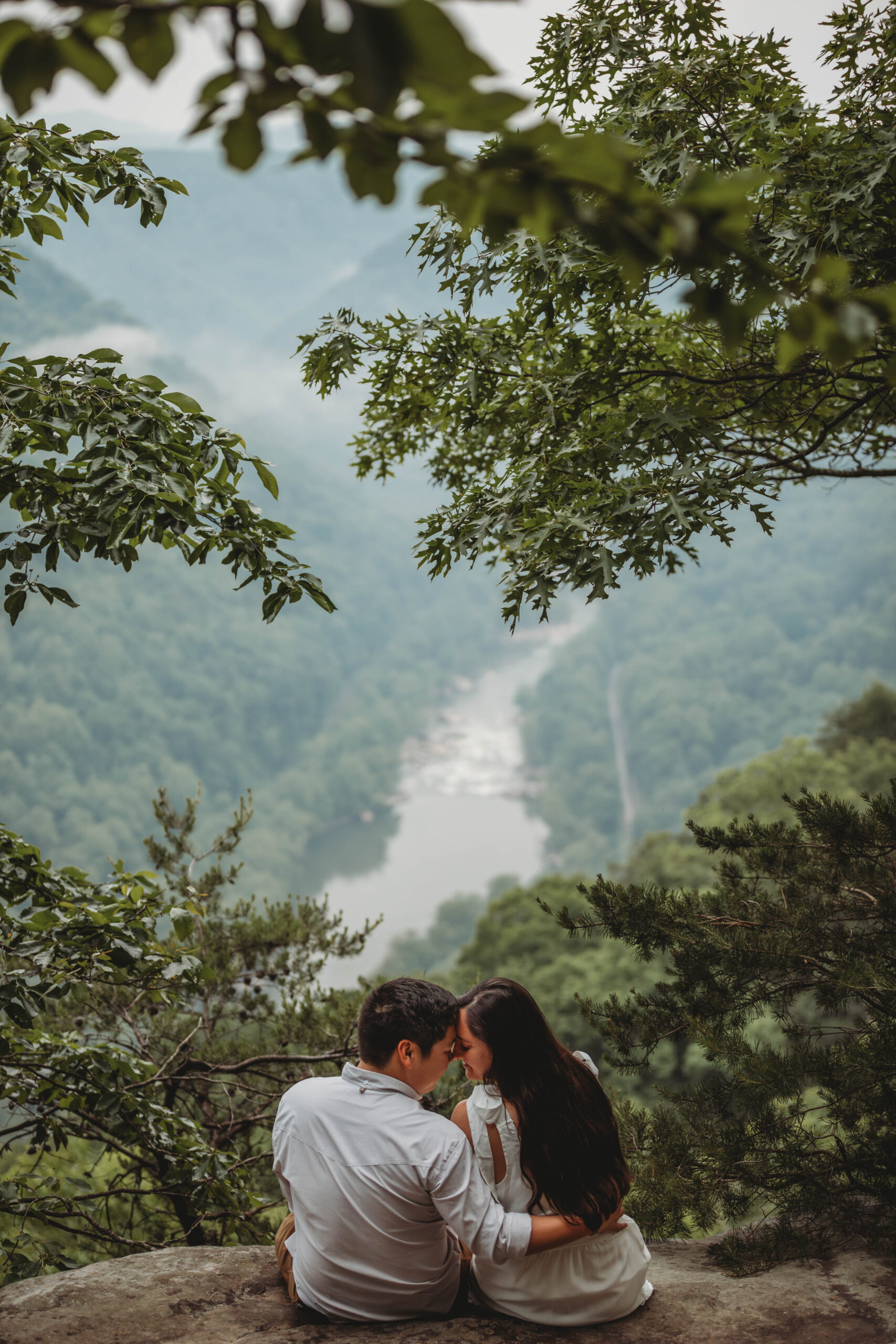 A couple share a moment together during their New River Gorge engagement photos.