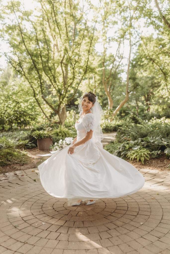 The bride dances at a Hahn Horticulture Wedding in Blacksburg, Virginia. 