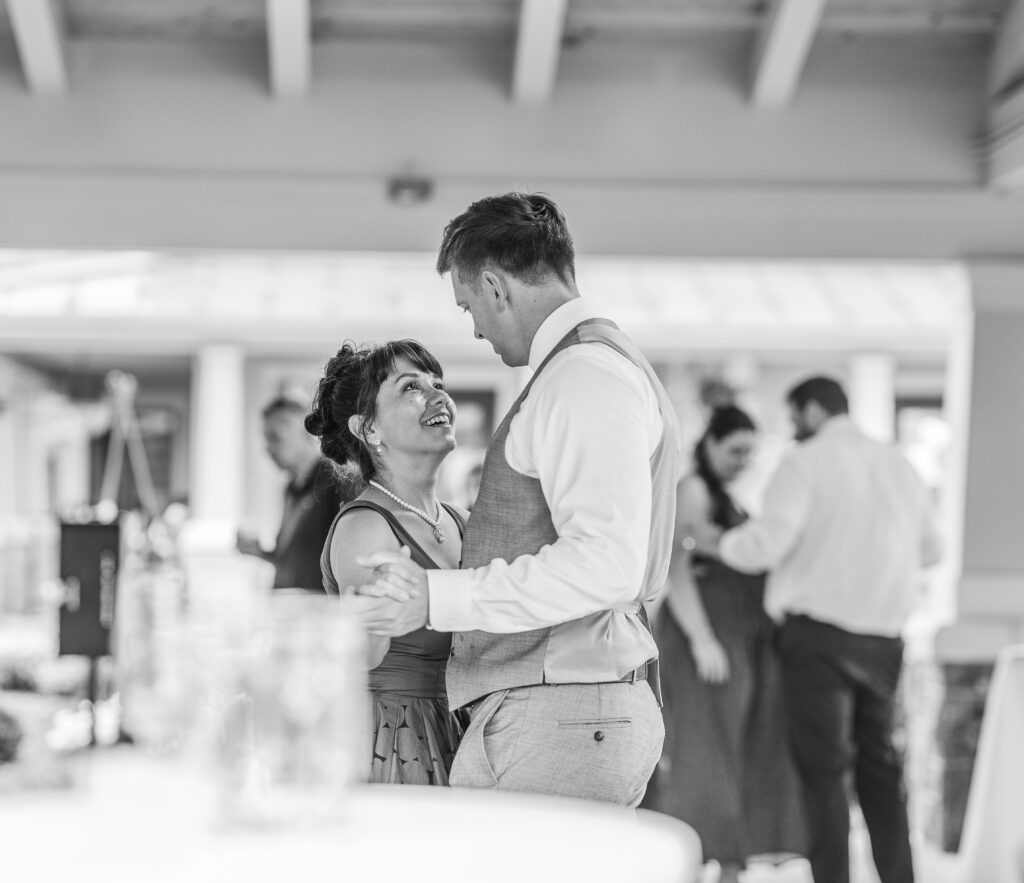 The bride looks at the groom at a Hahn Horticulture Wedding in Blacksburg, Virginia. 
