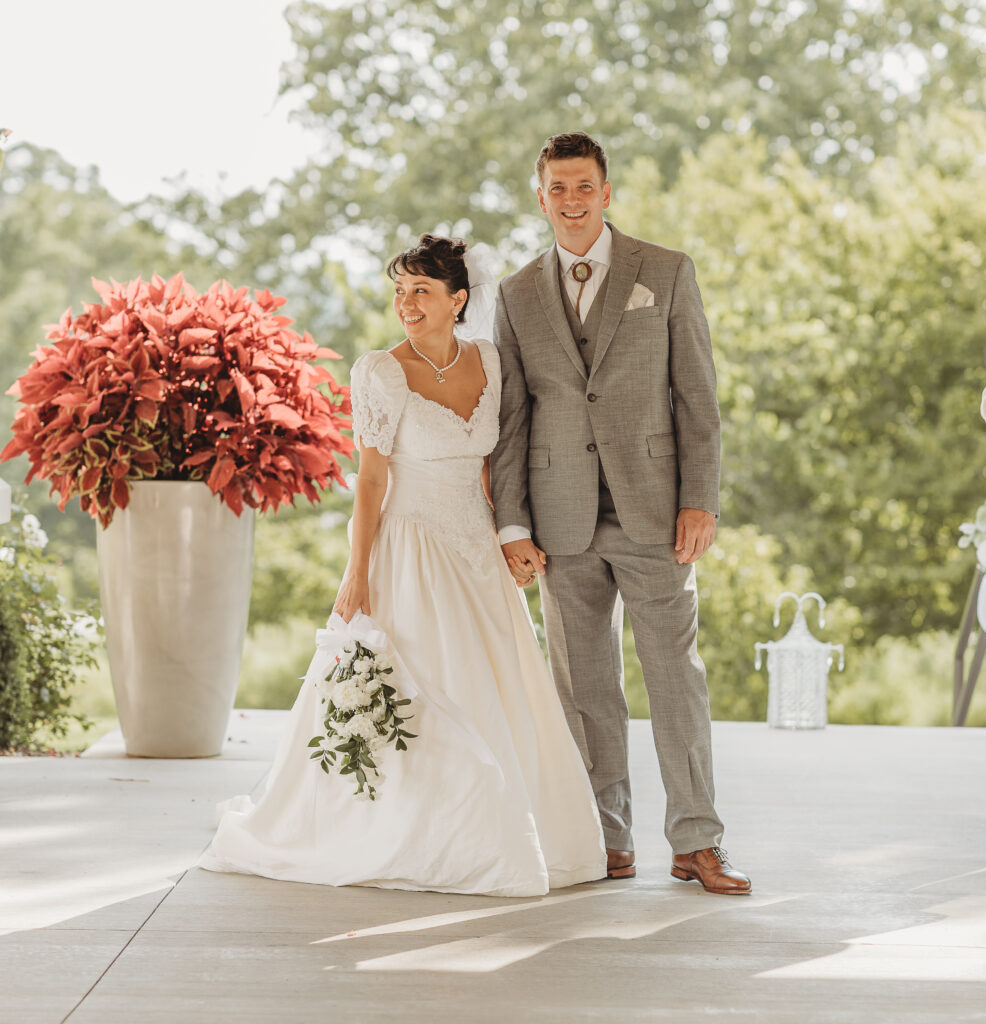 The bride and groom are excited at a Hahn Horticulture Wedding in Blacksburg, Virginia. 