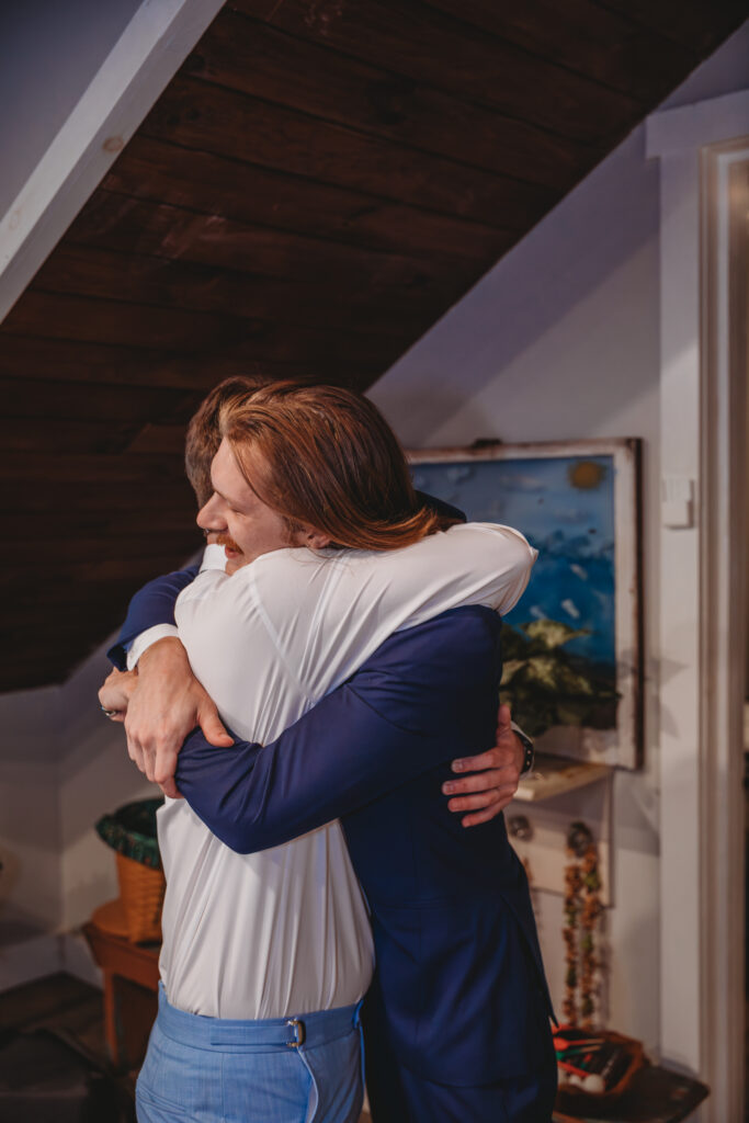 Groom hugging his best man at a Vintage Valley Wedding. 
