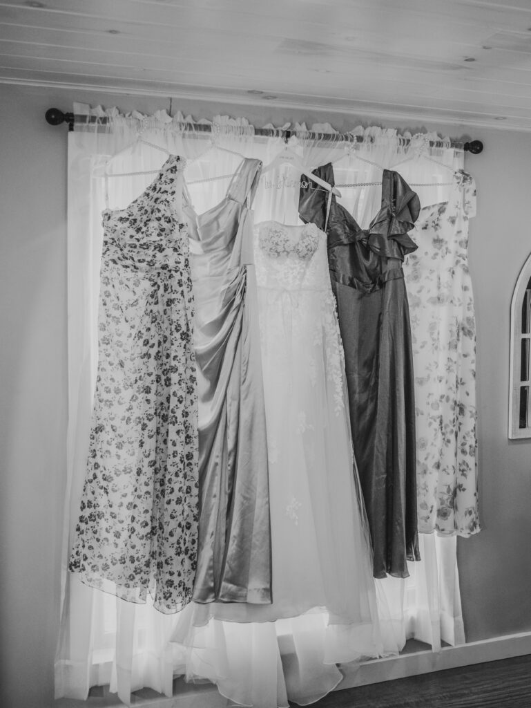 Dresses hanging in a room at a Vintage Valley Wedding. 