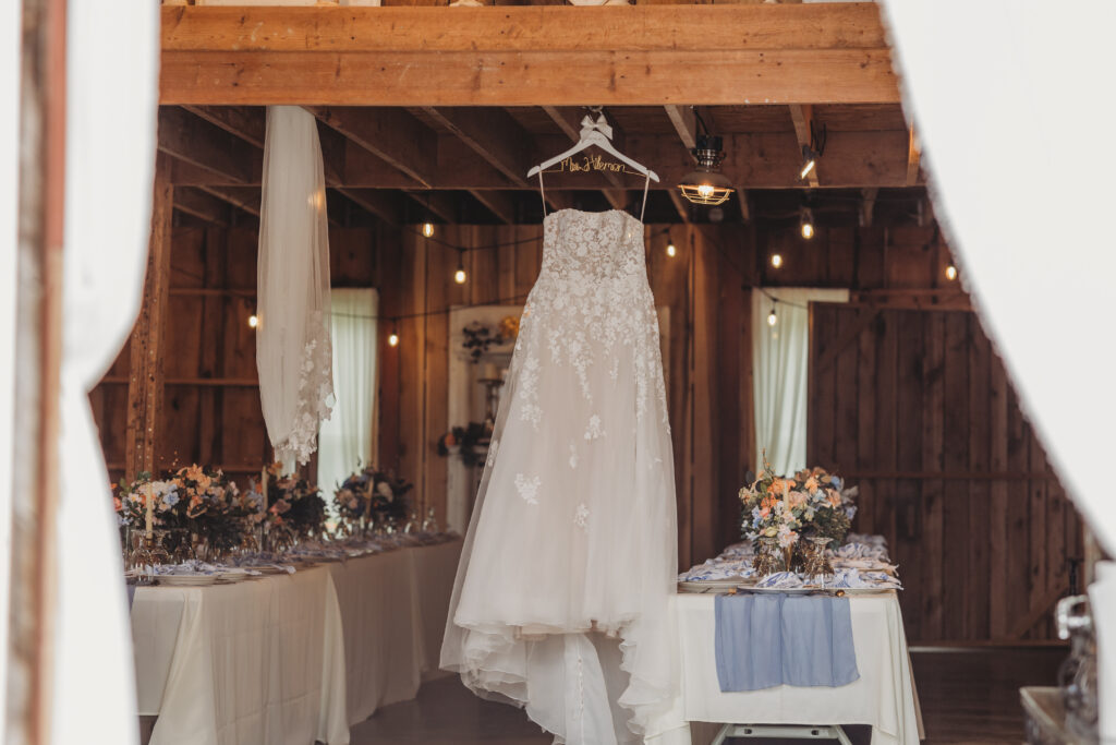 A vintage white wedding dress hanging