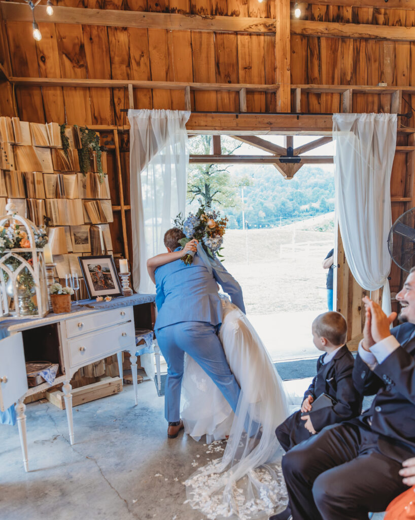 The groom dips the bride at a Vintage Valley Wedding. 