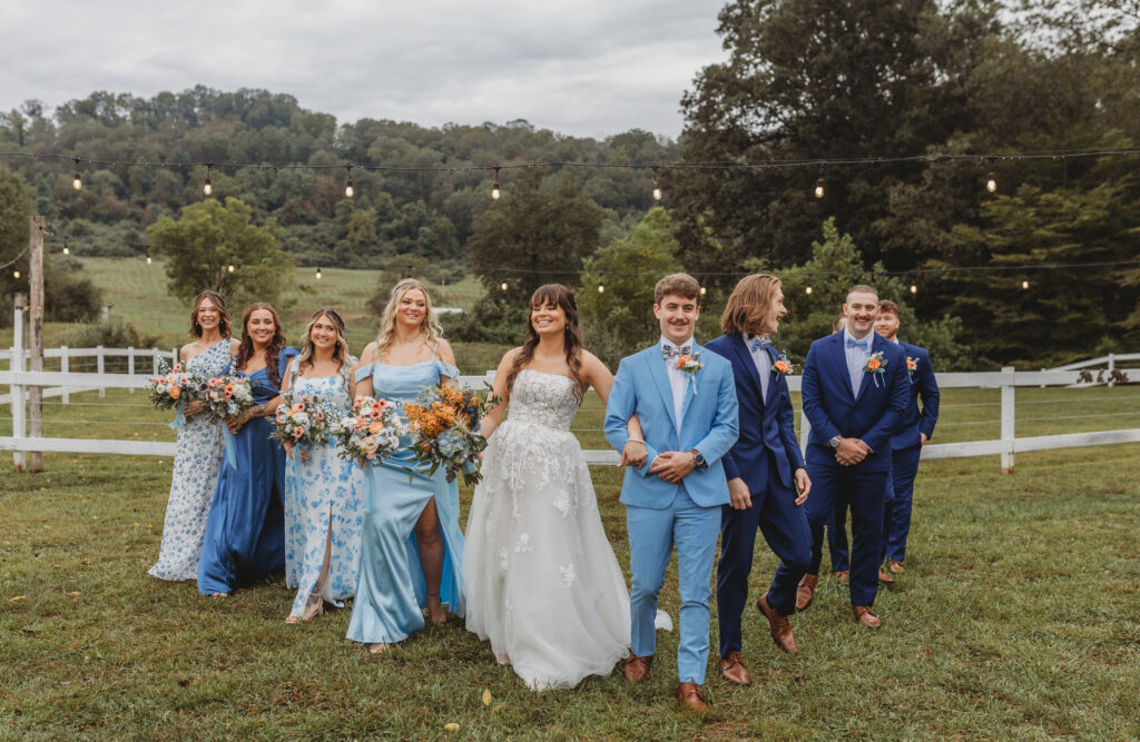 The wedding party walk together
