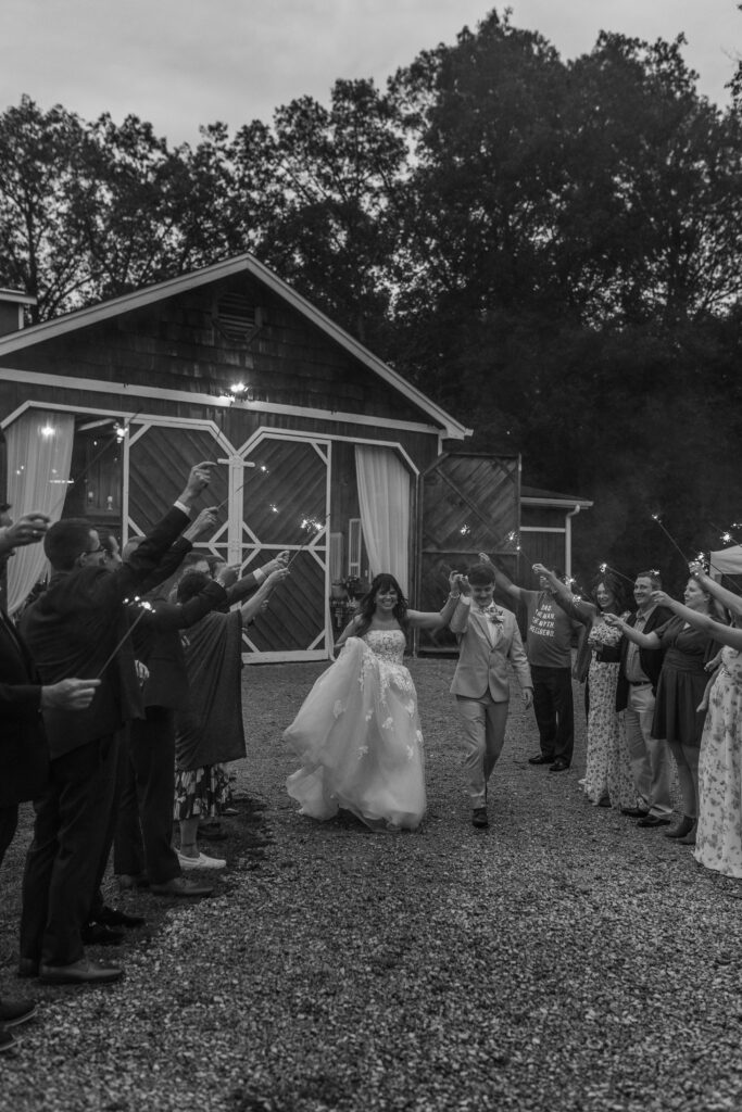 The bride and groom walk through at their sparkler exit at a Vintage Valley Wedding. 