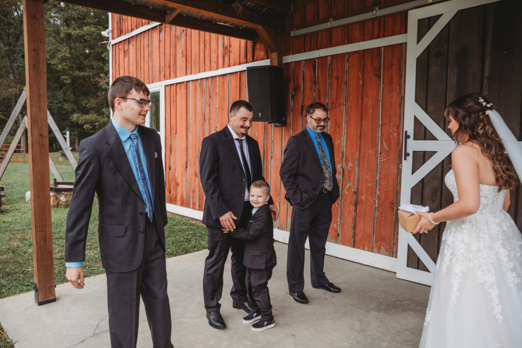 A first look between bride and brothers at a Vintage Valley Wedding. 